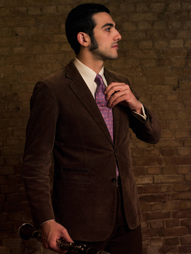 Eldar Tsalikov with a clarinet, alto saxophone, and vocals for The Jungle Jazz Band in Berlin, a top male jazz singer in Europe.